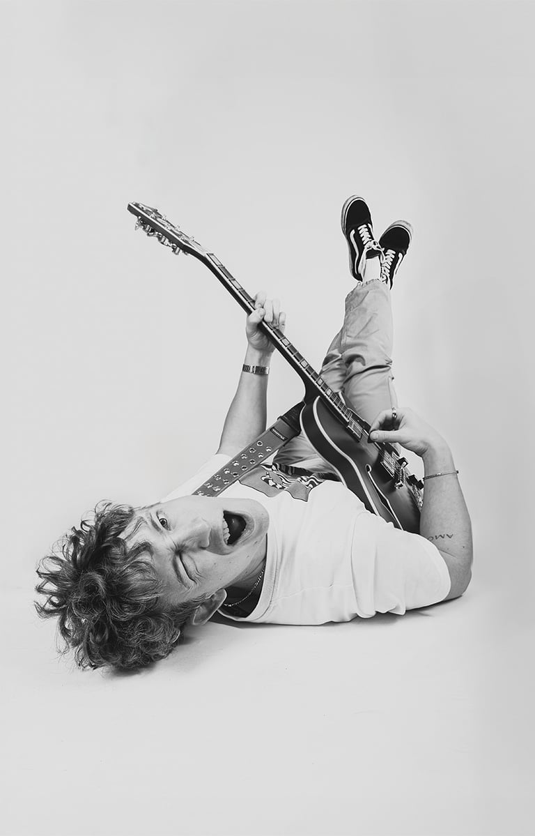 creative fashion portret a man with a guitar and a guitar