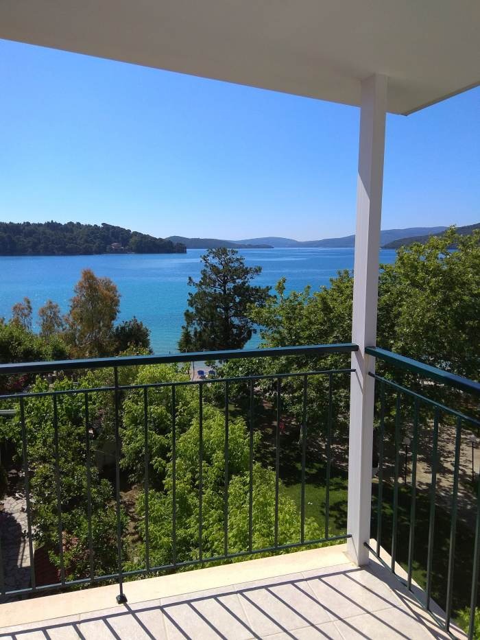 a balcony with a view of the ocean