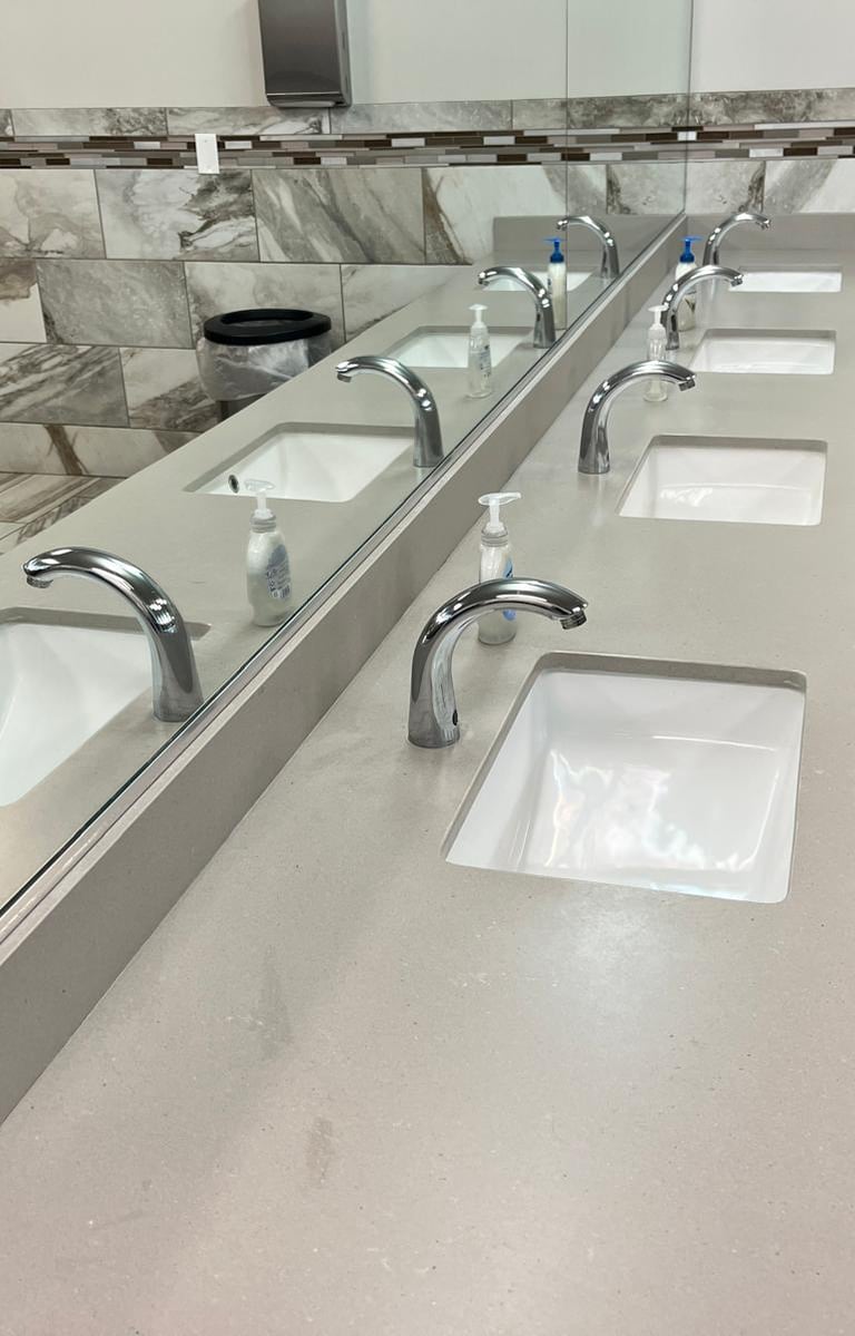 a bathroom with a sink and a mirror