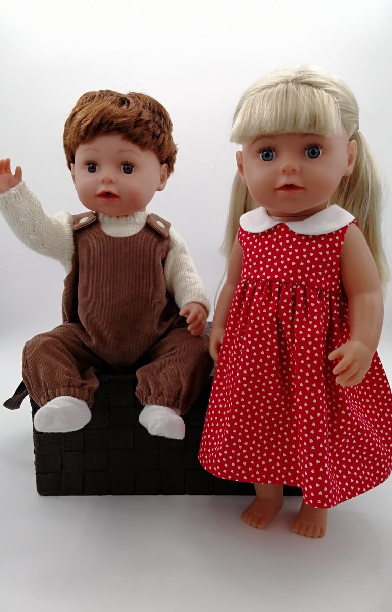Zapf Baby Born Big Brother and Big Sister dolls dressed in handmade clothing