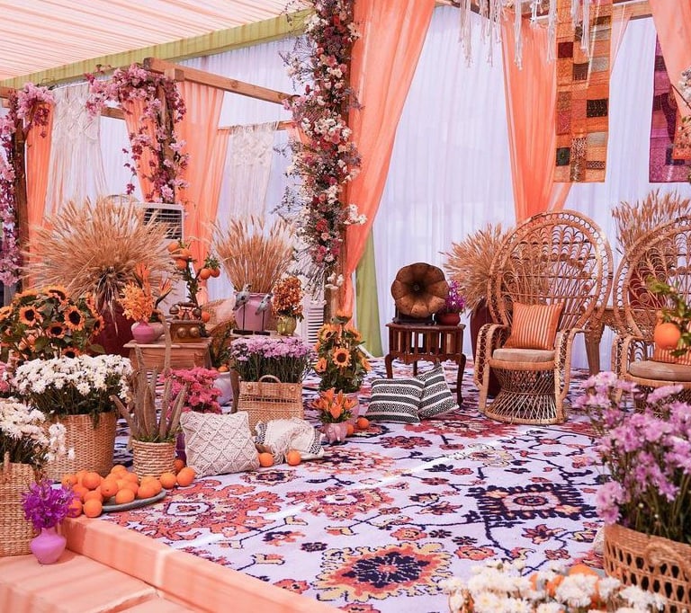 a decorated wedding ceremony with a large floral arrangement