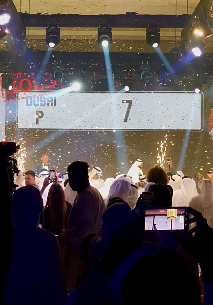 a group of people standing around a stage