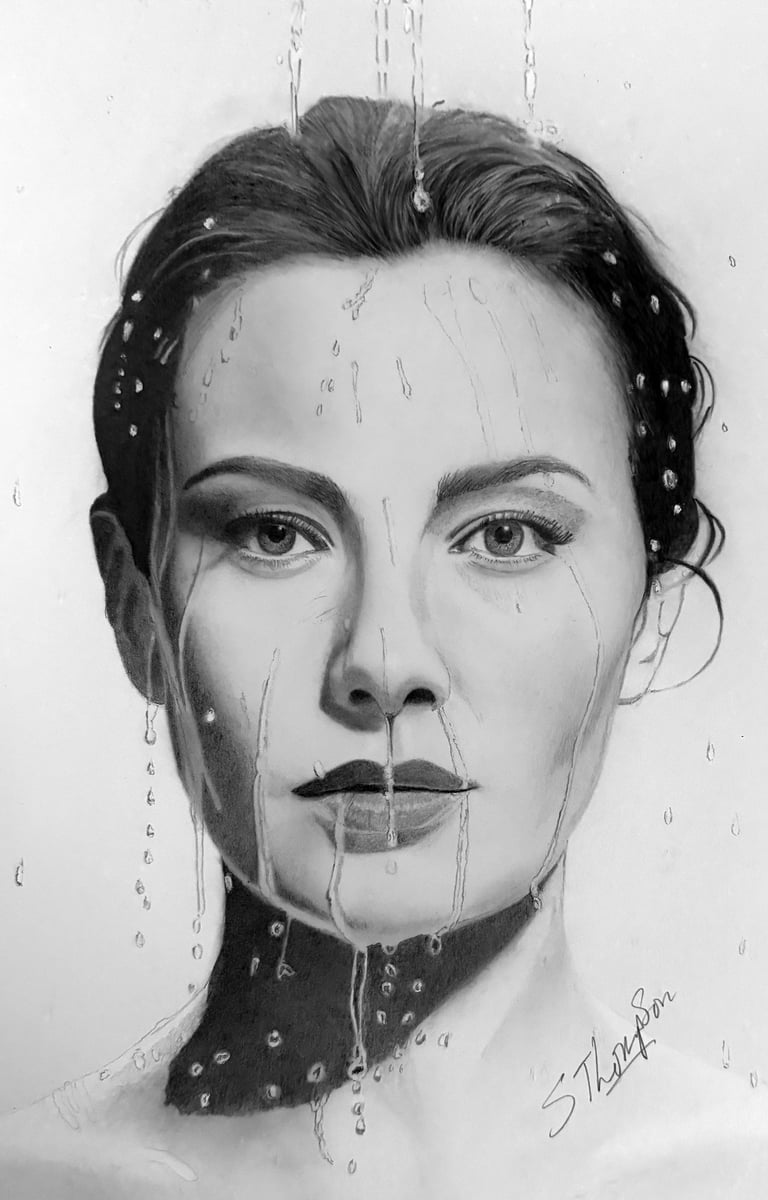 a drawing of a woman's face with a teary face