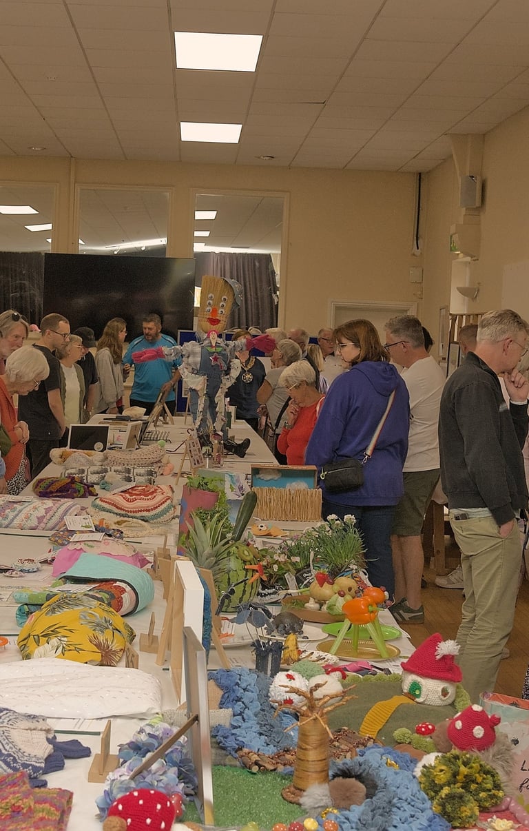 Visitors to The Sandy Garden & Craft Show admiring some of the exhibits on display.