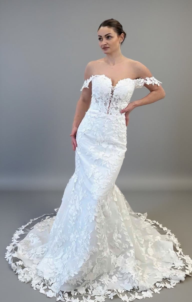 a woman in a white wedding dress with a white dress