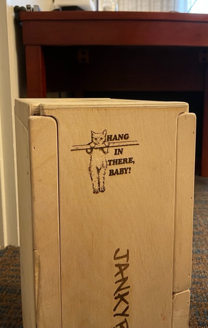 a refrigerator with a box of food inside of it