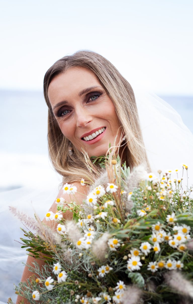 Bride posing on a Tenerife beach during a wedding photoshoot.