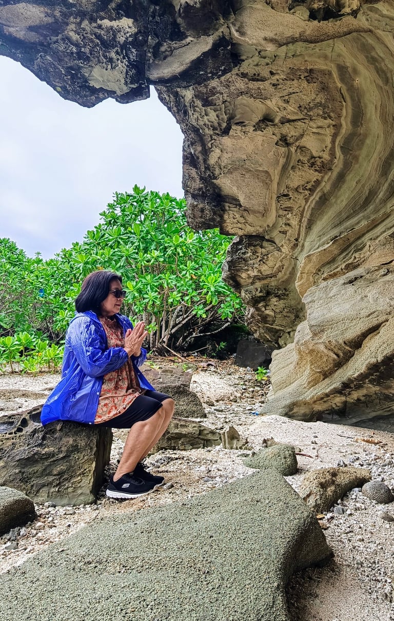 Woman Meditating at Rock Formation