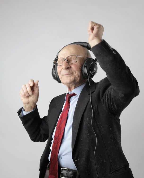 a man in a suit and tie with headphones