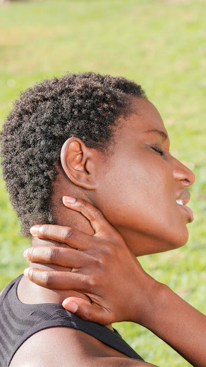 a woman with a black hair and a black top