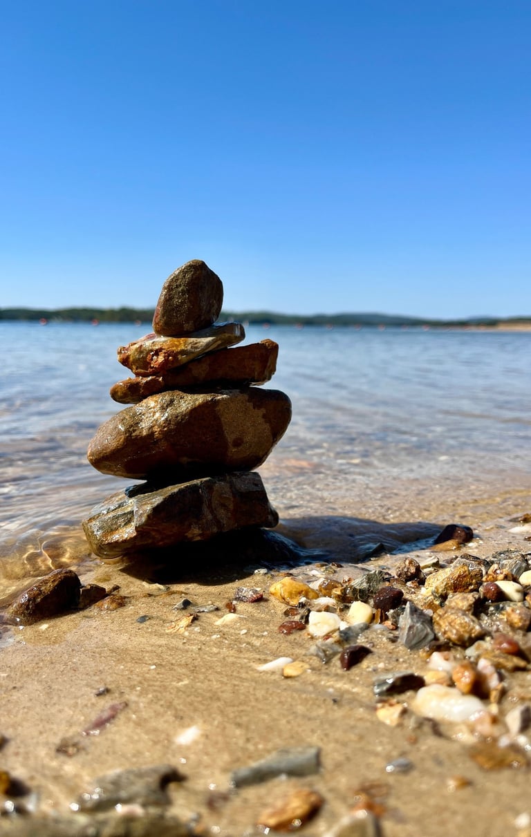 a stack of rocks sitting on the beach