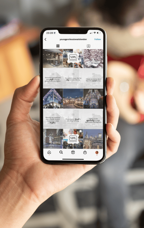 a person holding a cell phone in their hand