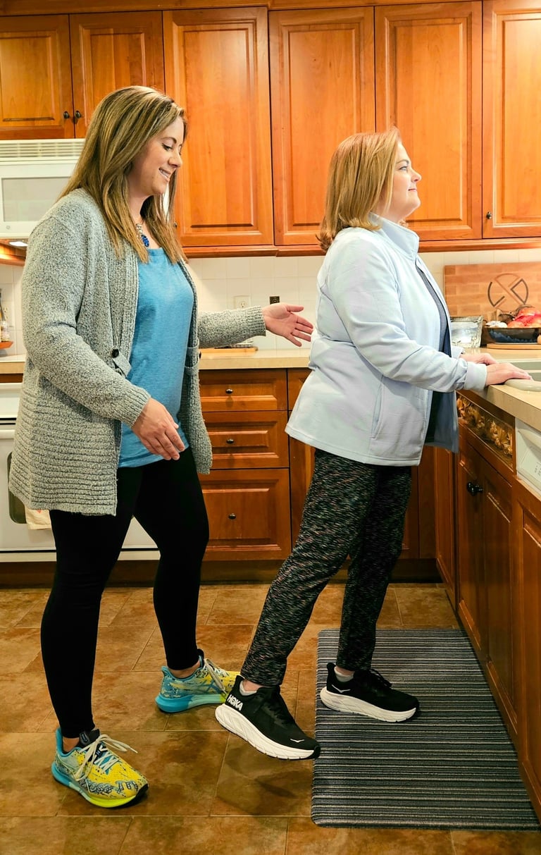 Physical therapy: teaching a patient an exercise at home.