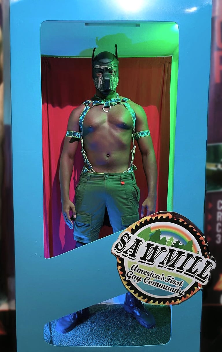 Man in pup mask posing in a giant toy box.