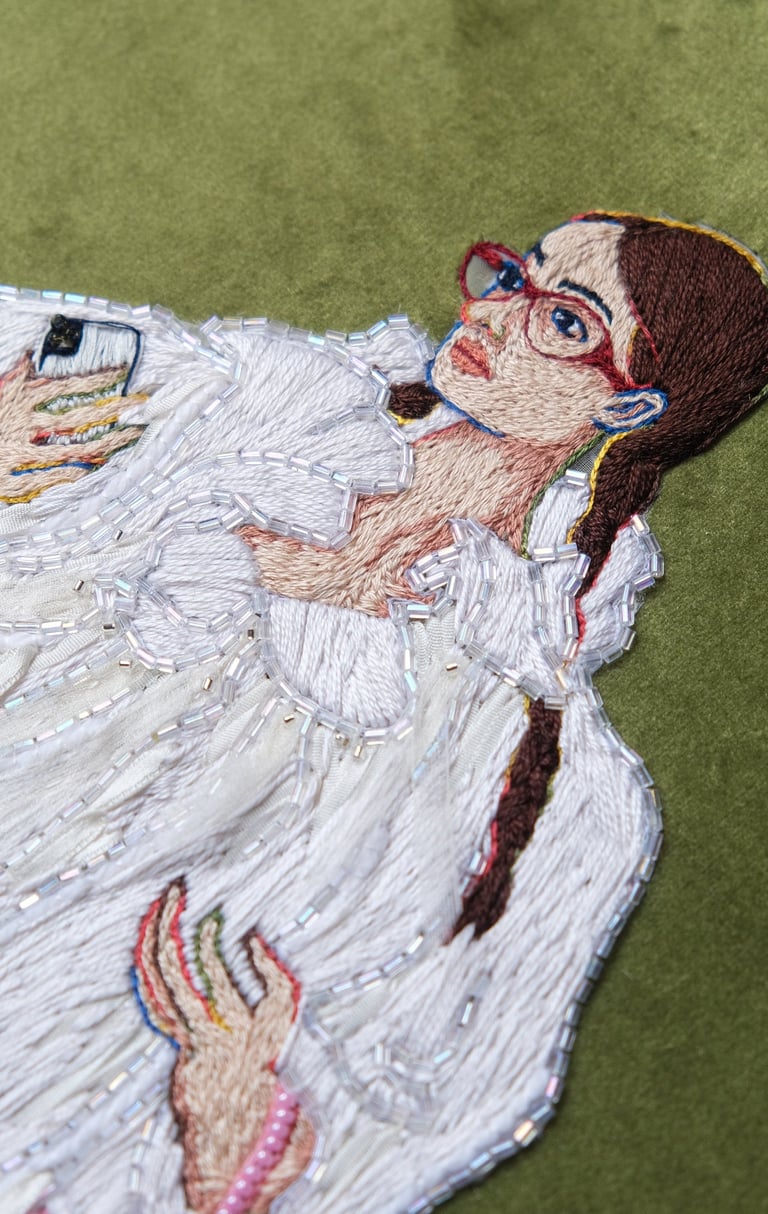 a woman in a white fur coat and boots embroidery and beaded pink bag