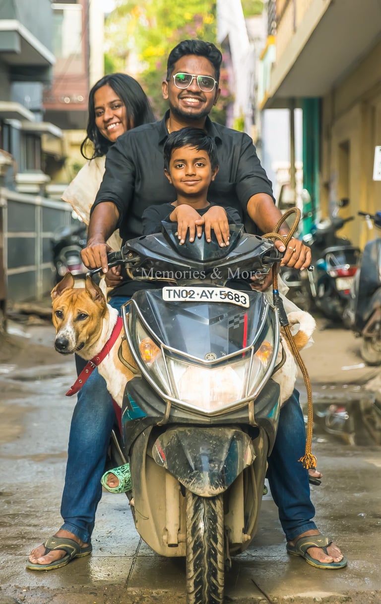 a man and two children on a scooter