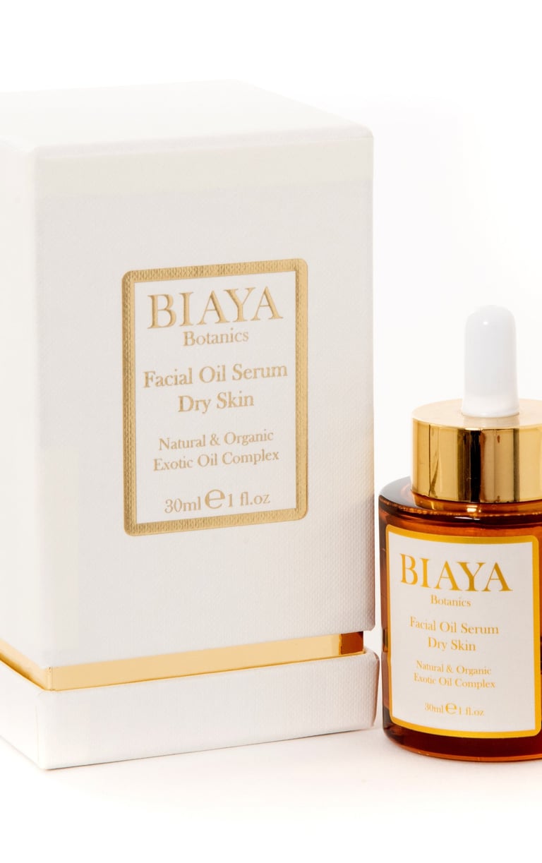 Biaya Botanics Facial Oil Serum Dry Skin in a gold and ivory box with an amber dropper bottle