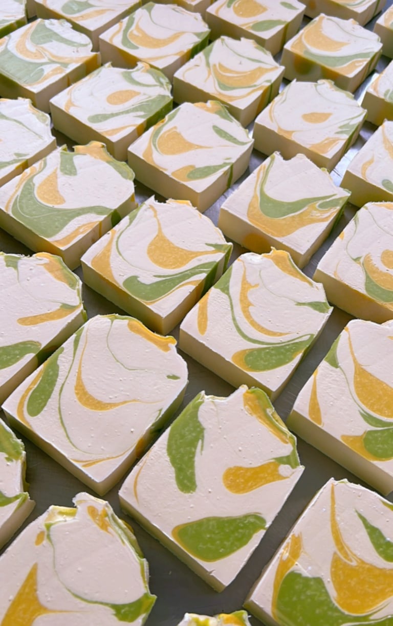 a table with a bunch of shea butter soap bars