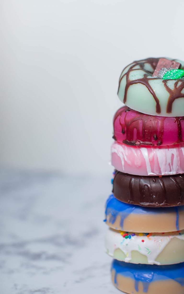 a stack of soap donuts with chocolate frosting