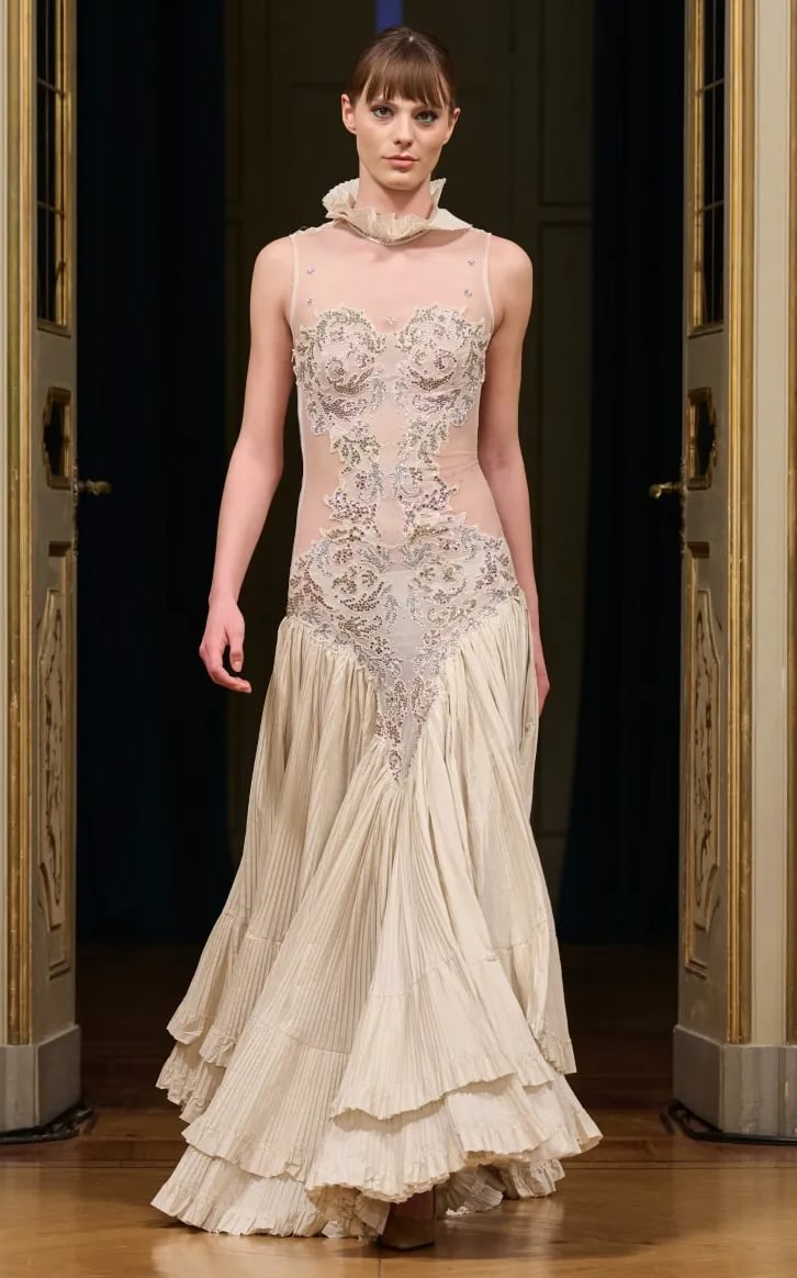 Anton Giulio Grande Spring/Summer 2026 Ivory embroidered dress with tiered pleated hem.