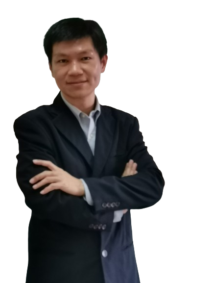 a man in a suit and tie standing in front of a computer