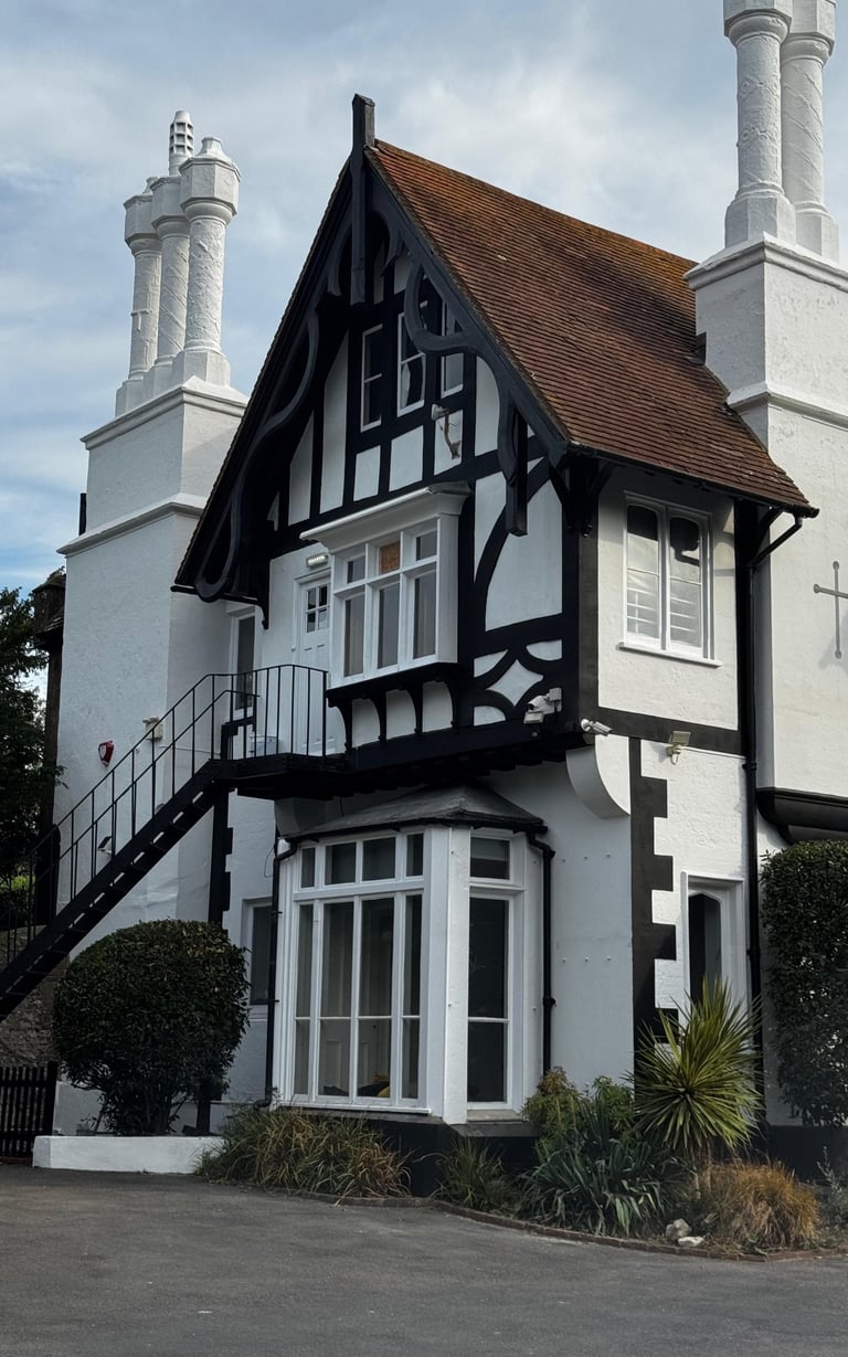 Church house exterior painting in Lancing Sussex, heritage black and white finish