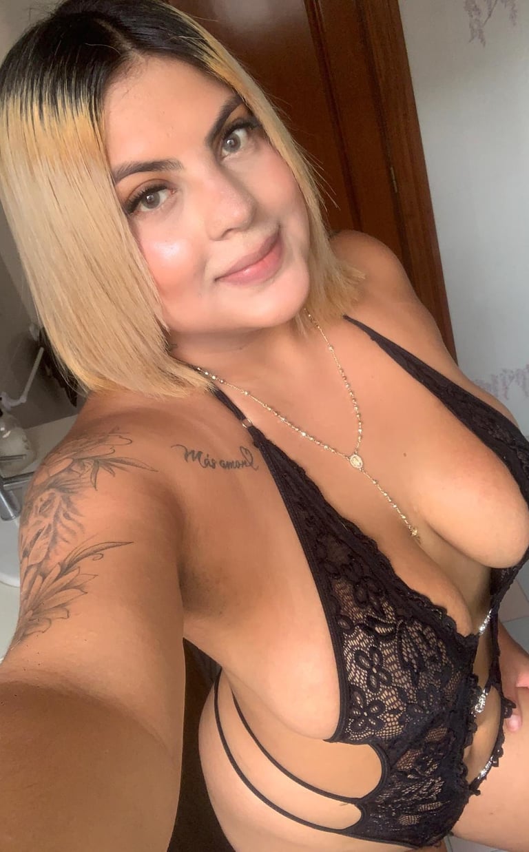a woman with tattoos on her chest and chest