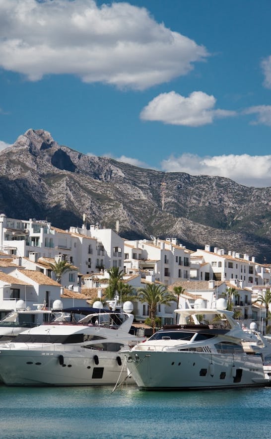 View of Puerto Banus, the iconic marina in Marbella with La Concha mountain in the background