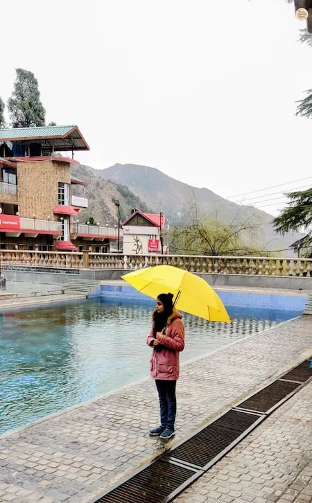 Sacred water kund at Bhagsunag Temple in McLeod Ganj, Dharamshala, visited by pilgrims for prayer and spiritual cleansing.