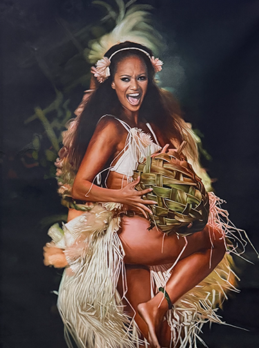 Polynesian dancer in traditional grass skirt performing a cultural hula dance with a woven basket.