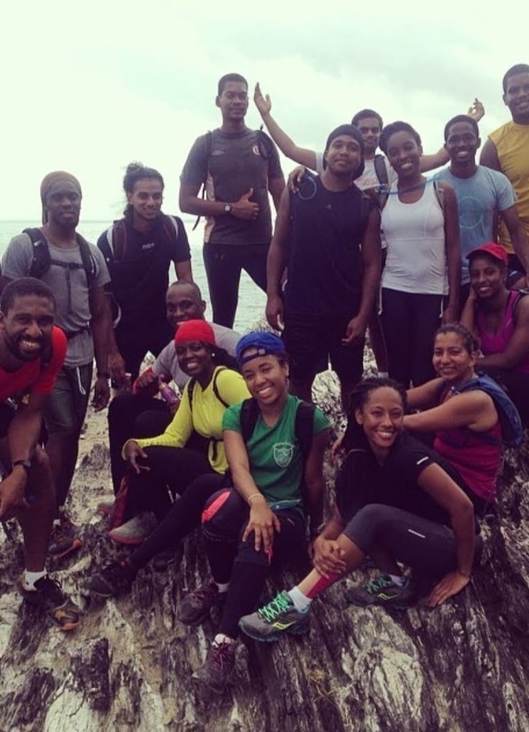 a group of young hiker standing on a rock formation