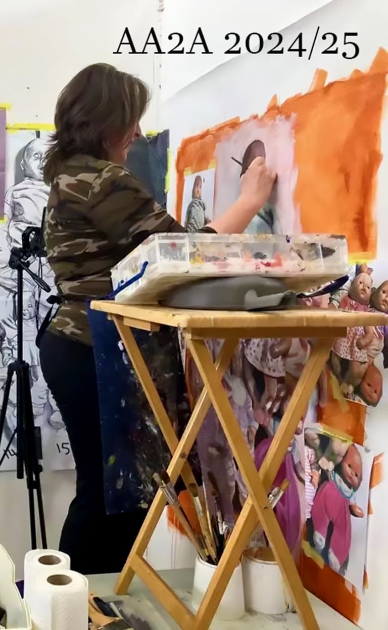 A studio photo of the artist Christine Gallagher at her work at the University of Chester