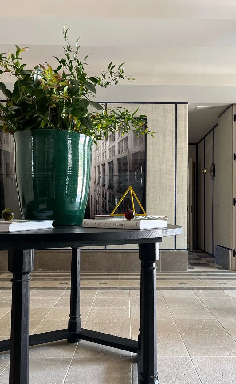 Entrance foyer at Villa La Gratitud with sculptural console and fresh florals