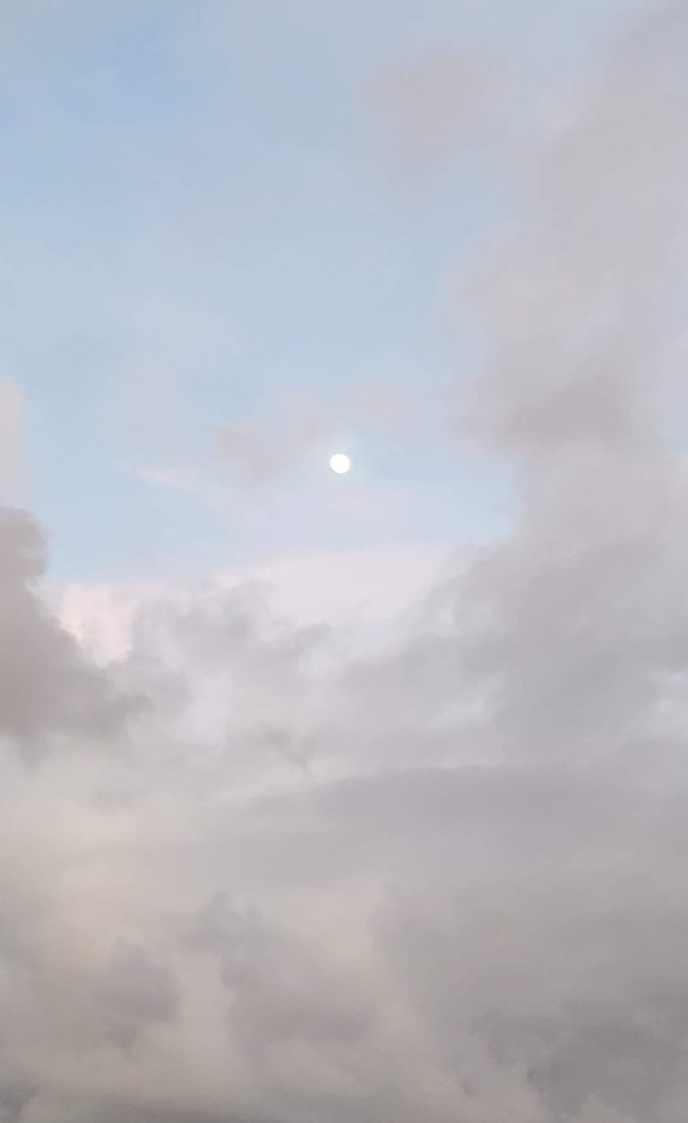 moon between clouds
