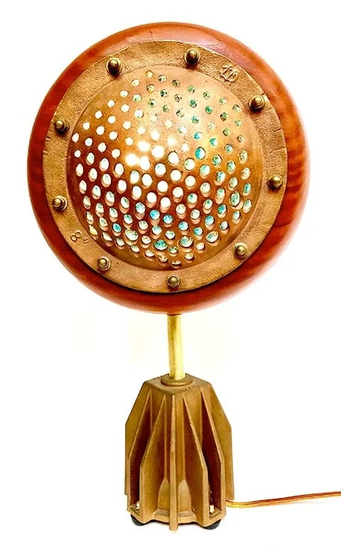 Custom light made from brass boat drain and redwood.