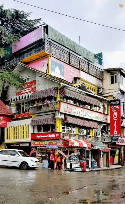 McLeod Ganj square with cafés and local shops.