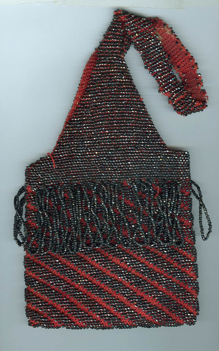 1930s handmade beaded evening purse hematite-color beaded fringe and stripes on red cloth background