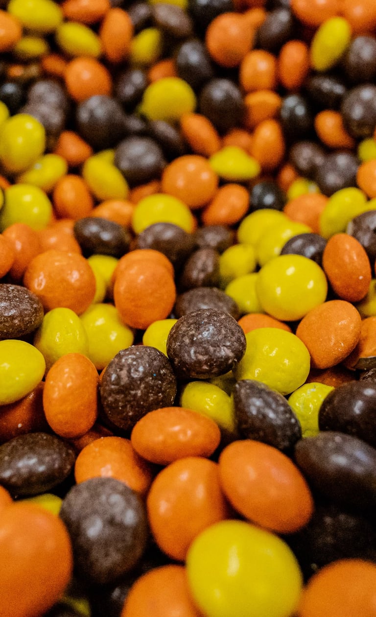 Close-up product photography of colorful chocolate candies.