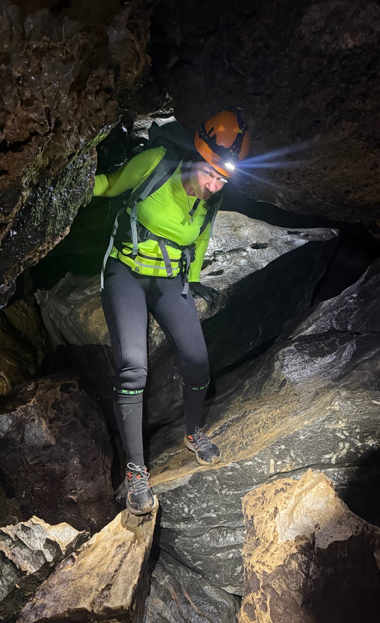 Tracey Billington climbing through a boulder field in Hang Son Doong Cave to get to doline 1