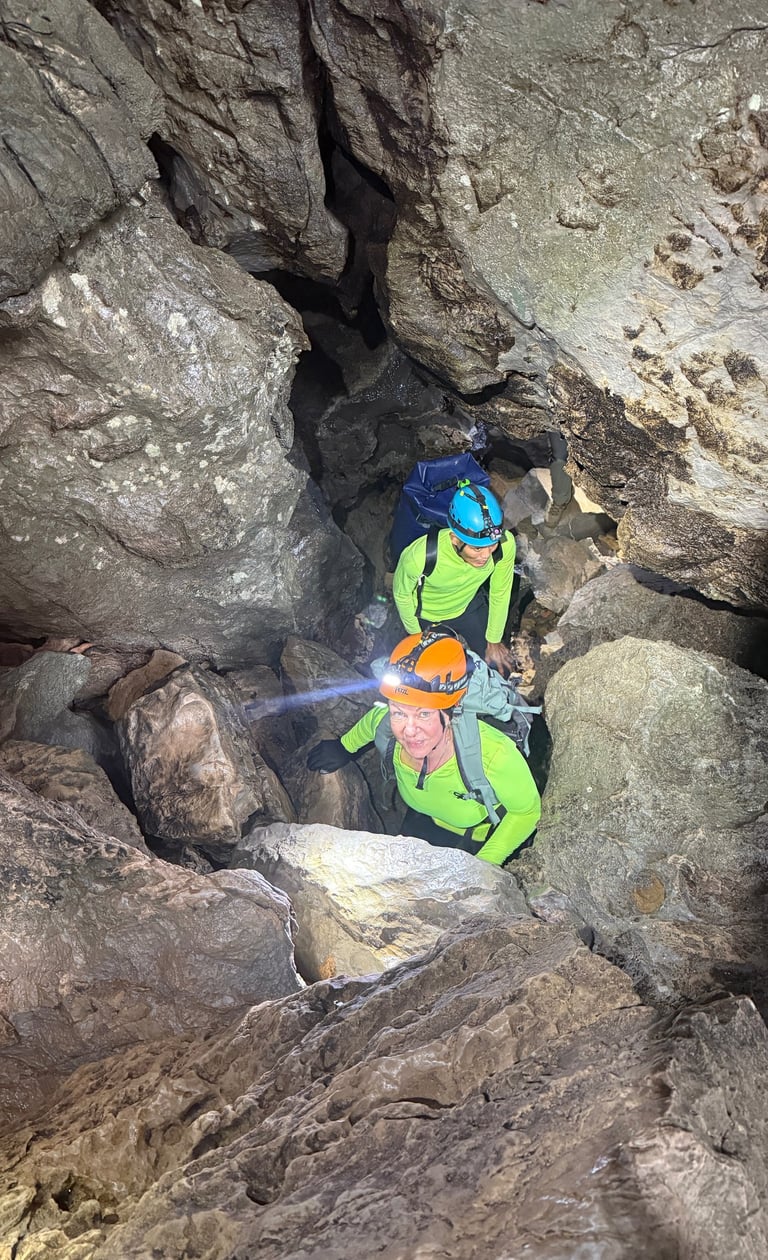 Tracey Billington climbing through a boulder field in Hang Son Doong Cave to get to doline 1