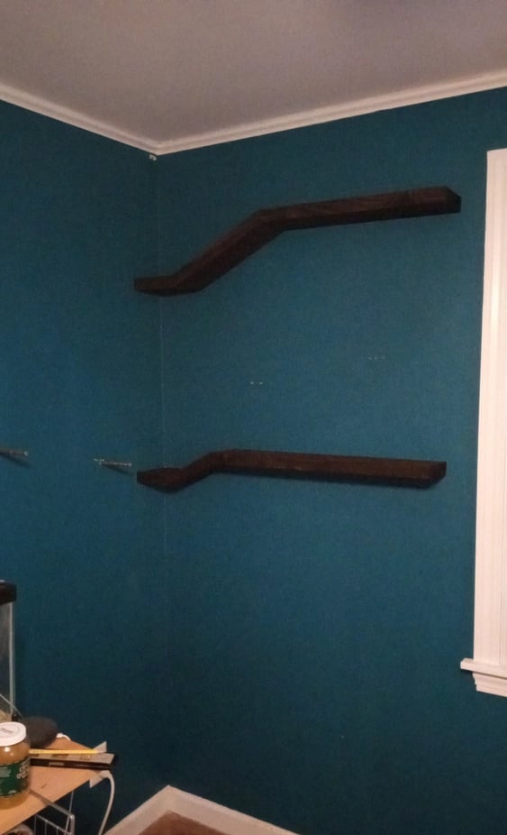 2 floating shelves installed, steel posts ready for another to be mounted