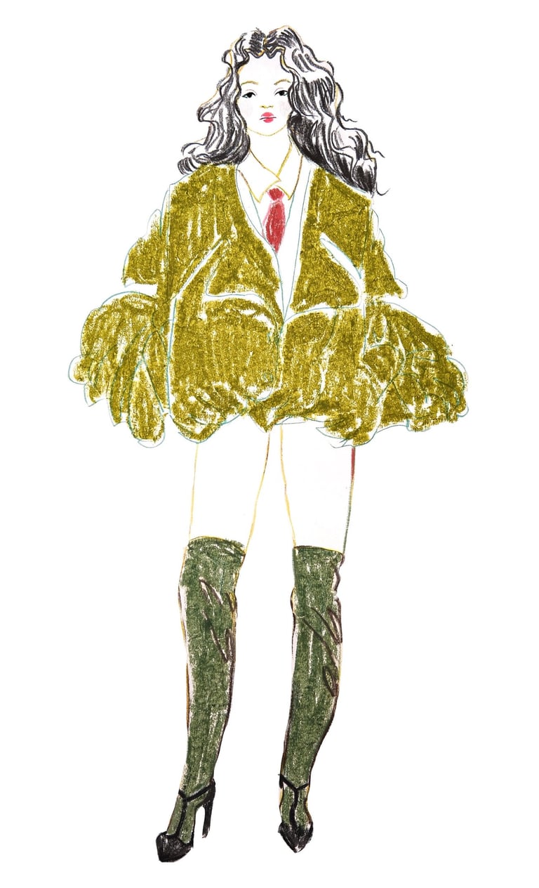 a fashion woman in a green coat and boots