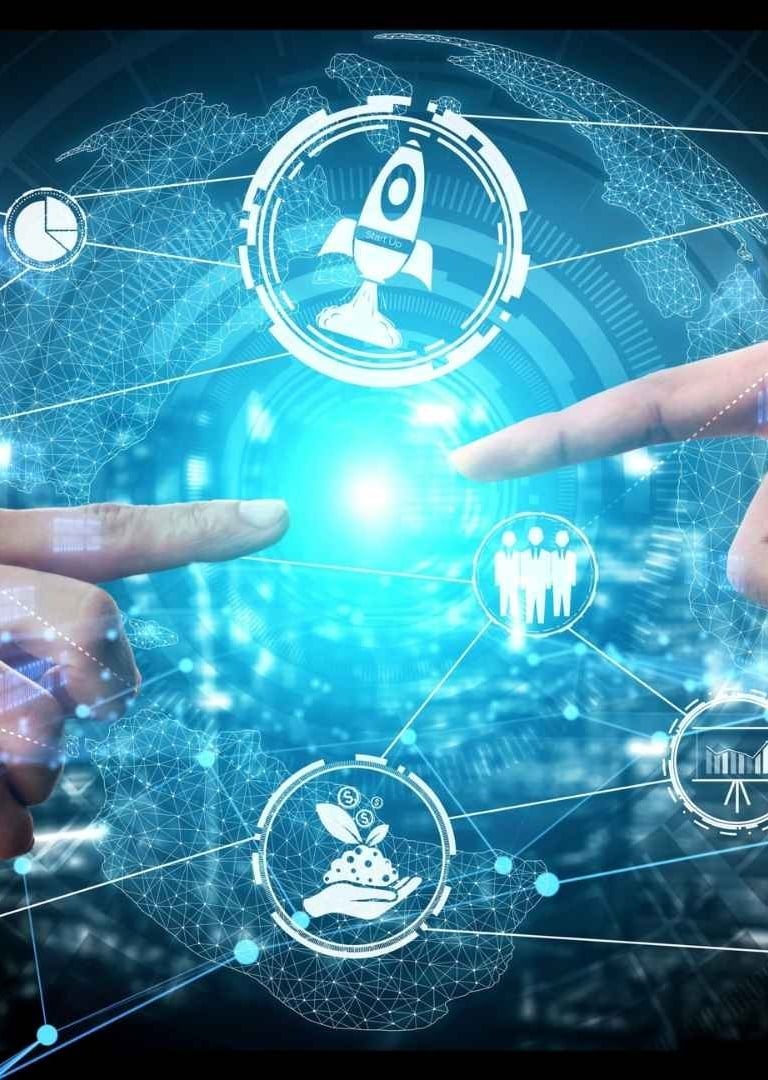 two hands touching a finger on a digital display - Illford Academy