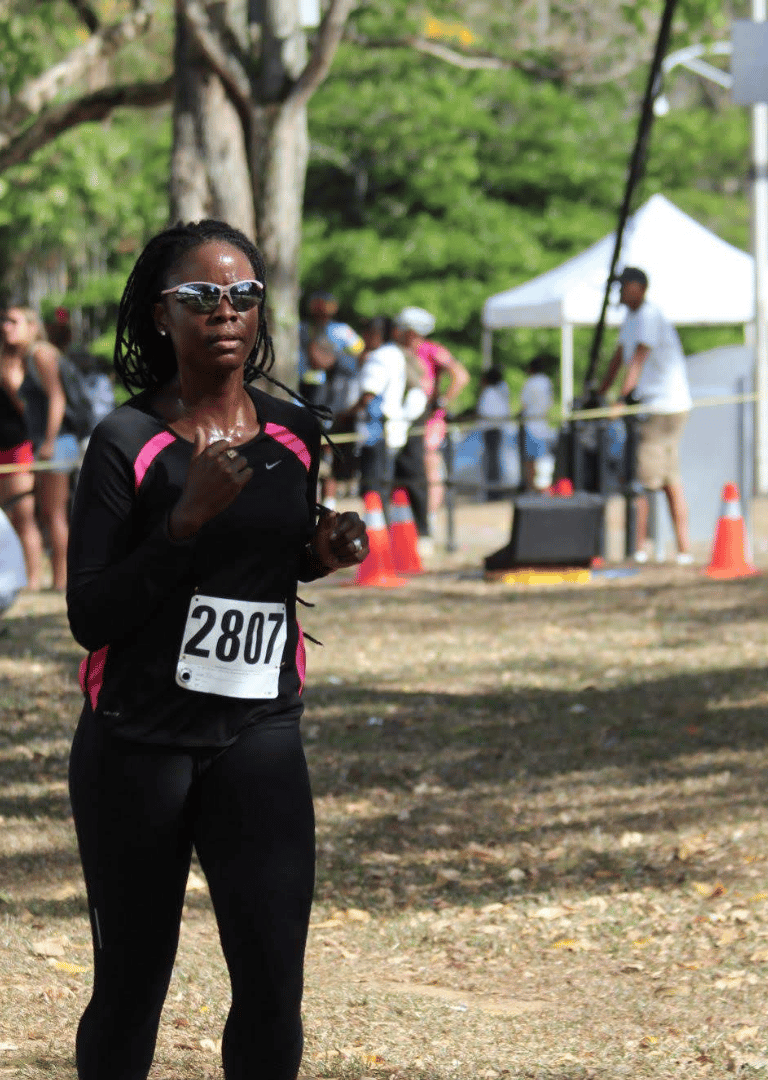 The nutritionist in a black top and sunglasses completing her first ever national duathlon