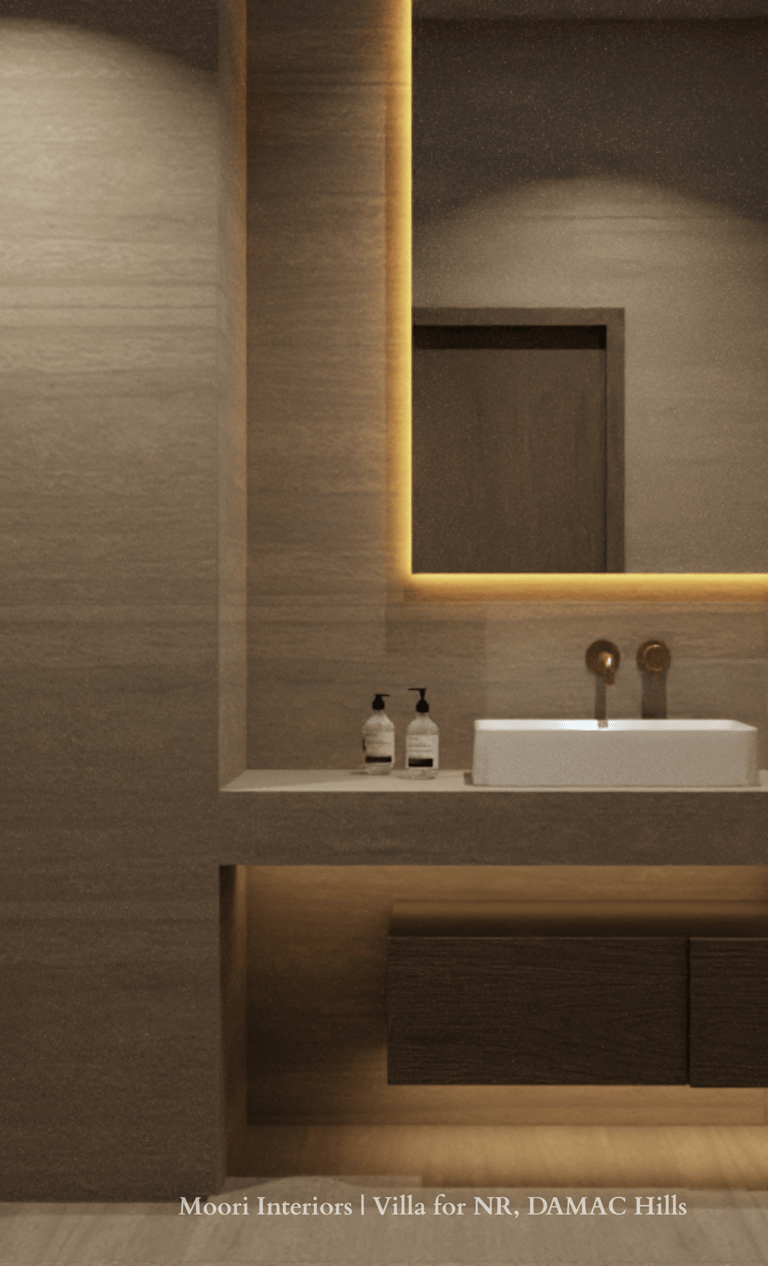 Bathroom mirror with integrated cove lighting, a white sink and dark wood vanity with underlighting