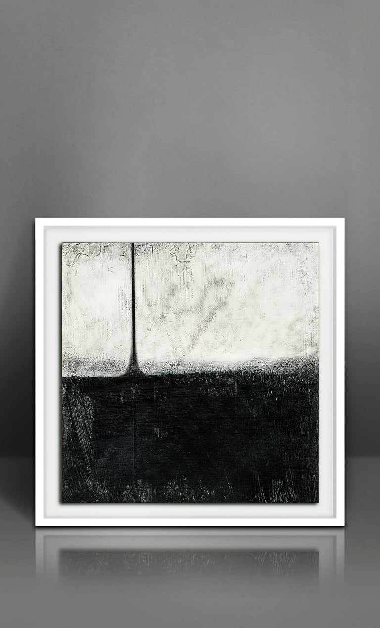 Framed black and white abstract painting with minimalist landscape textures on a gray wall.