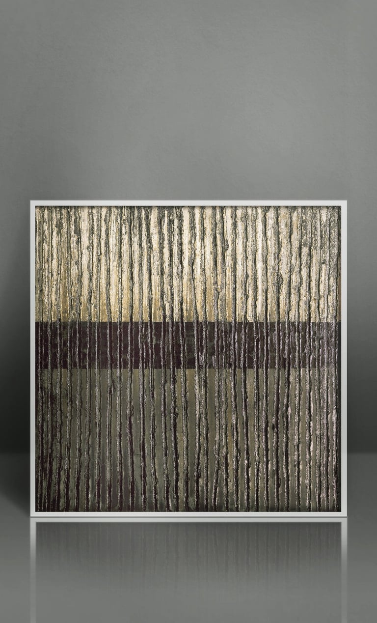Modern abstract wall art with gold and black textured vertical lines in a white frame.