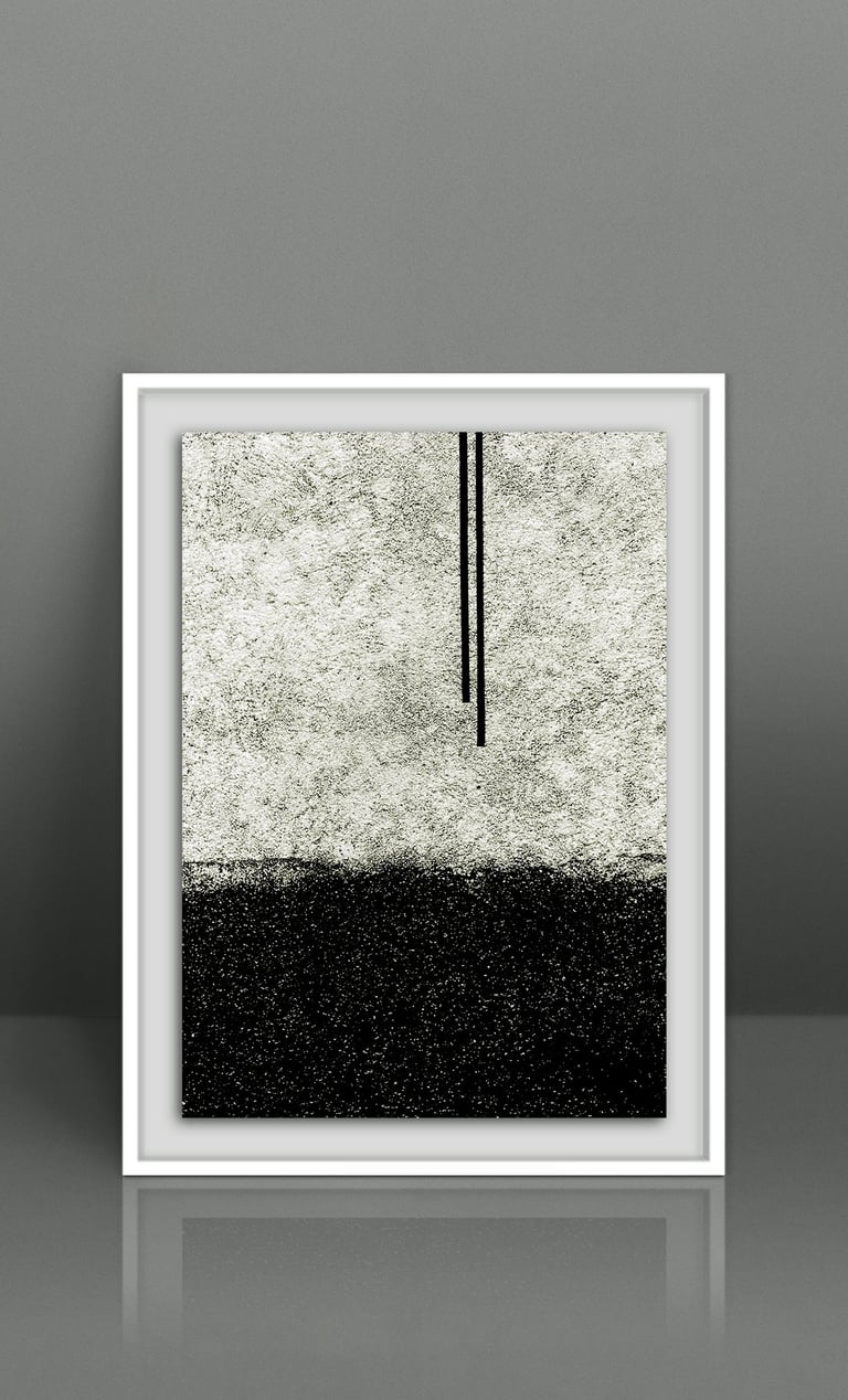 Minimalist black and white abstract wall art in a white frame, featuring a stippled landscape design.