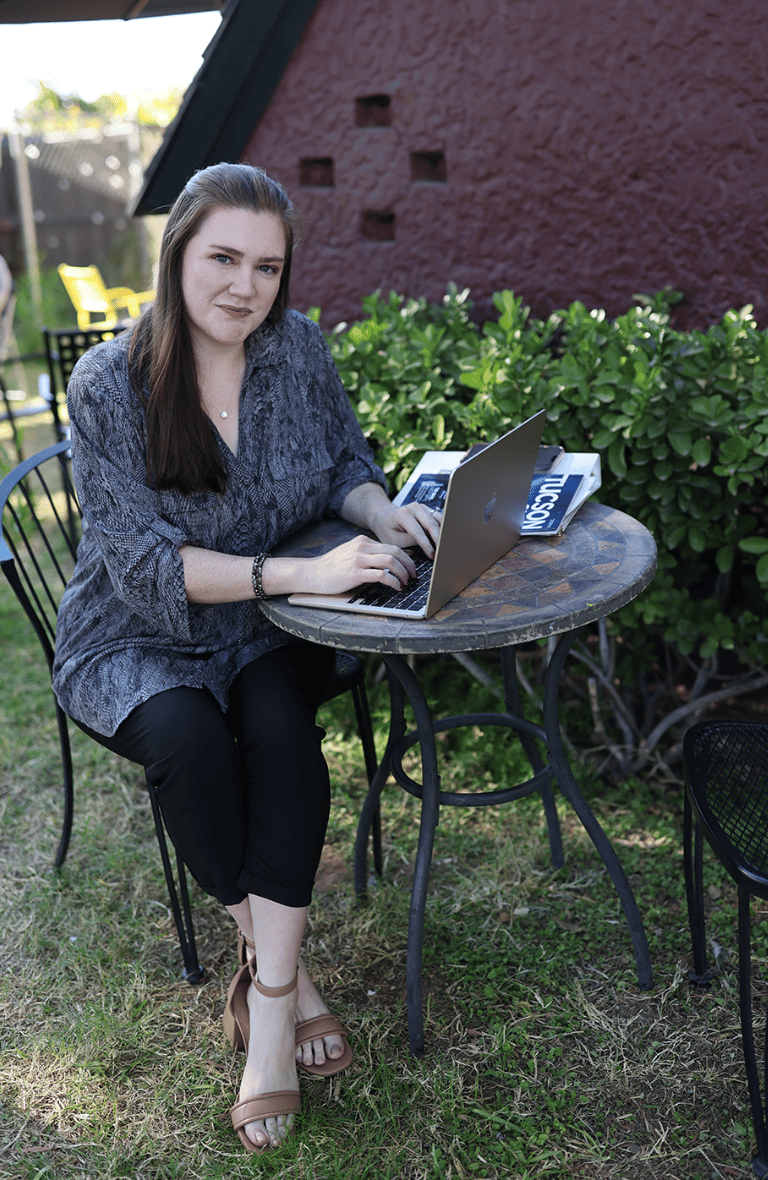 Marissa Wright of Sage & Craft Media with laptop