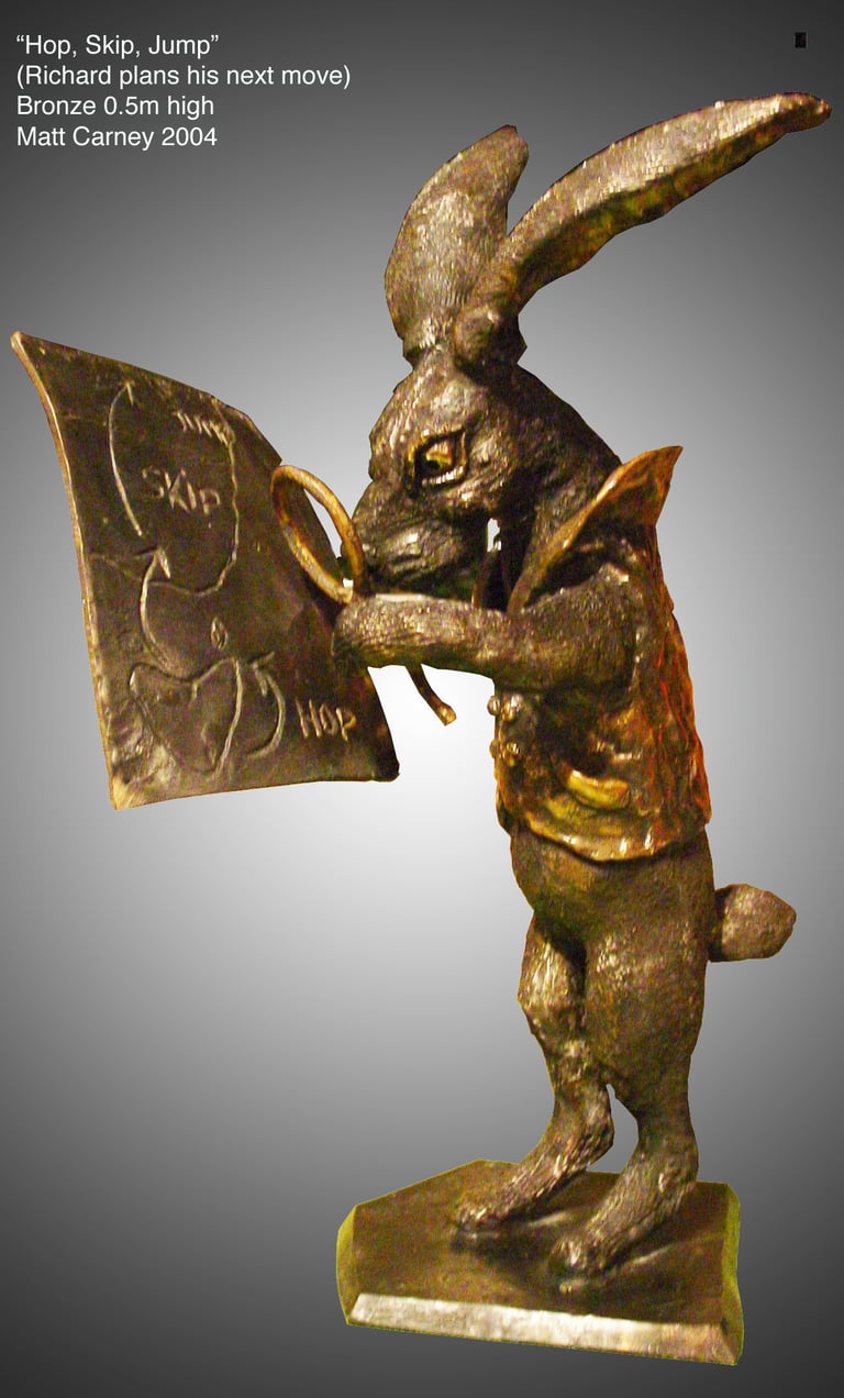 a statue of a rabbit with a mao that says,'hop, skip, jump